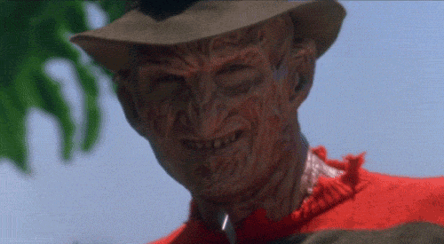 A GIF of Freddy Krueger putting on a pair of sunglasses