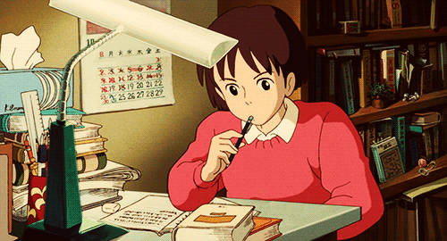 A GIF of an anime girl studying at her desk.