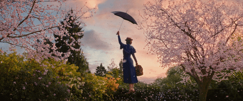 A GIF of Mary Poppins using her umbrella to fly.