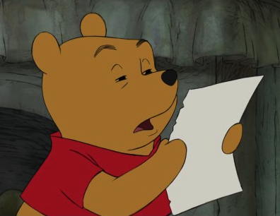 A still of Disney's Winnie-the-Pooh reading from a piece of paper with his eyes squinted and brows raised.